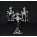 A pair of cut and moulded clear glass twin light lustre candelabra