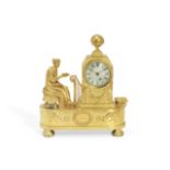 A Regency gilt bronze figural mantel timepiece depicting the allegory of love the movement signed...