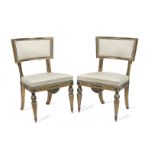 A pair of Swedish 19th century giltwood and painted 'curule' side chairs (2)