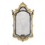 A giltwood and ebonised marginal mirror in the European Rococo style