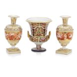 A Derby twin handled urn and a pair of Derby vases Circa 1830