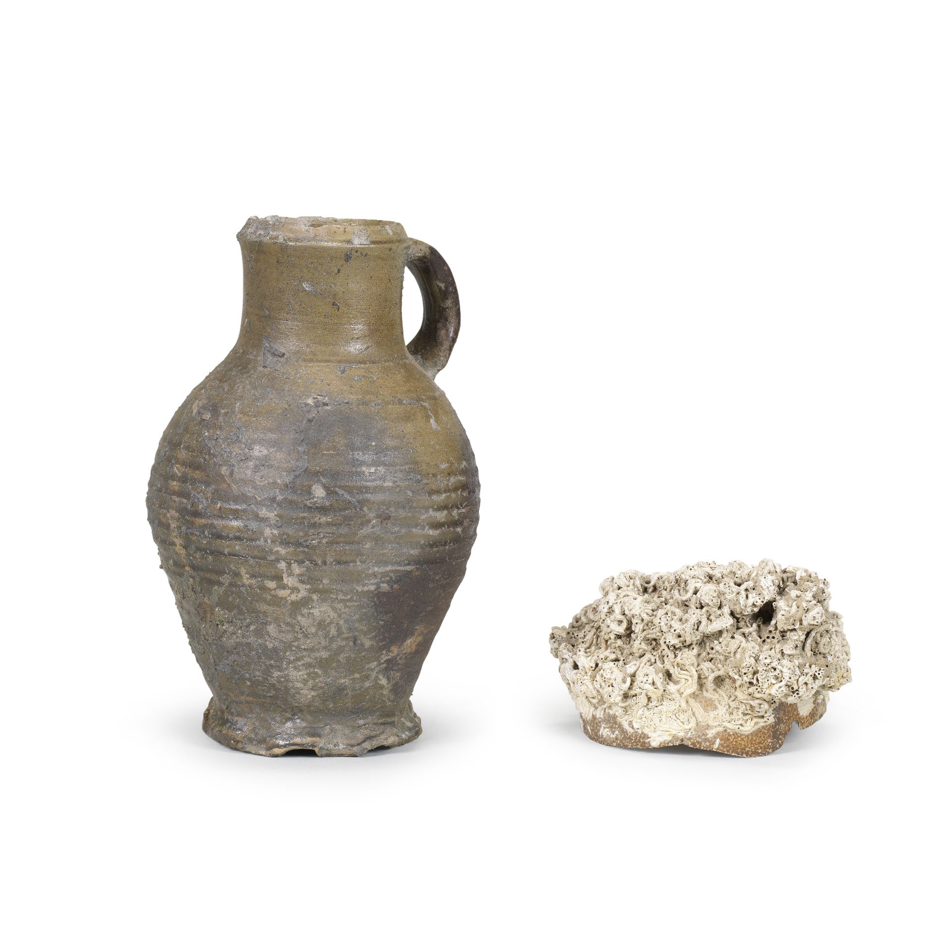 A Rhineland stoneware jug together with an encrusted stoneware shard 15th Century