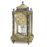 A late 19th/early 20th century onyx and champlevé enamel mantel clock Inscribed to the dial Stewa...