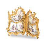 A LATE 19TH/EARLY 20TH CENTURY GILT METAL AND VIENNESE ENAMEL TIMEPIECE IN THE FORM OF A TWO FOLD...