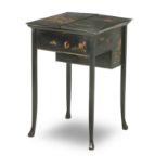 An early 20th century black lacquered writing table