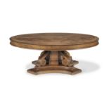 A large mid-19th century oak, pollard oak and ebony line inlaid circular extending dining table