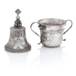 A late Victorian silver table bell and a modern Britannia standard porringer a the bell by Willia...