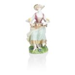 A Meissen figure of a lady playing the hurdy-gurdy 18th century