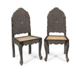 A pair of Anglo-Indian 19th century carved ebonised chairs (2)