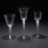 Two mixed twist wine glasses and an incised twist wine glass 18th Century