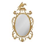 An 18th century style giltwood oval mirror, 20th century