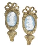 Two 19th century gilt brass porcelain inset curtain tie backs (2)