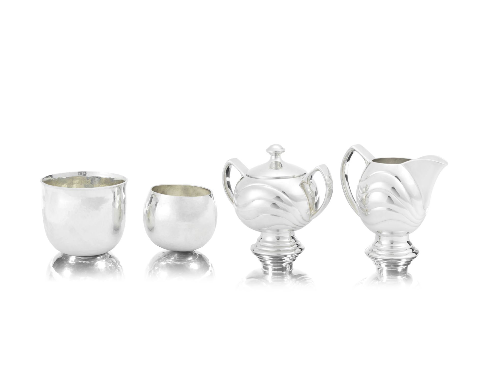 HECTOR MILLER: a silver cream jug and covered sugar bowl London 1998 With undulating linear decor...