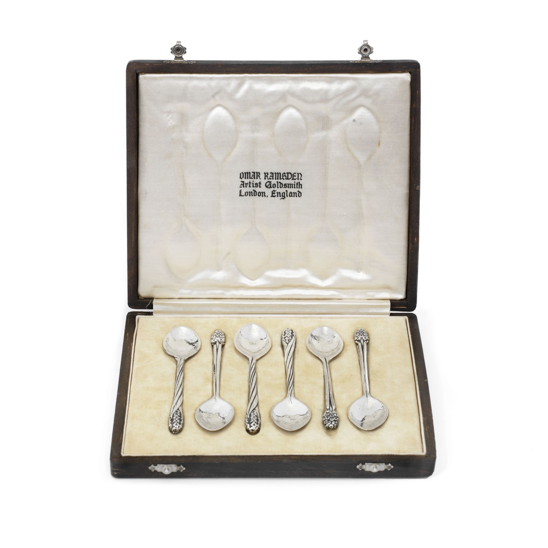 OMAR RAMSDEN: a cased set of six silver coffee spoons London 1938, one spoon unmarked