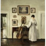 Carl Vilhelm Holsøe (Danish, 1863-1935) Interior with cello and woman reading