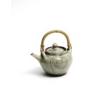 Ladi Kwali (Nigerian, circa 1925-1984) Green glazed teapot 19 x 19.5 x 15.5cm (7 1/2 x 7 11/16 x ...