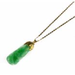 A carved jadeite pendant with chain, early 20th century