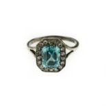 A blue zircon and diamond cluster ring