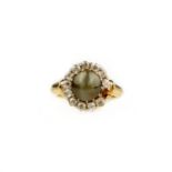 A cat's eye chrysoberyl and diamond cluster ring