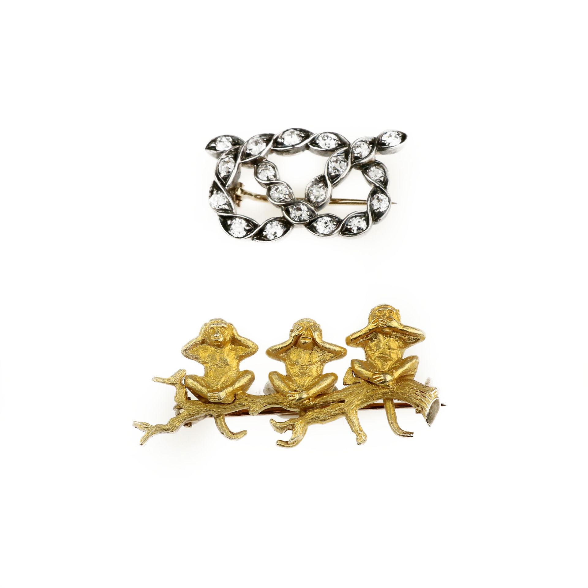 A diamond knot brooch and a monkey brooch