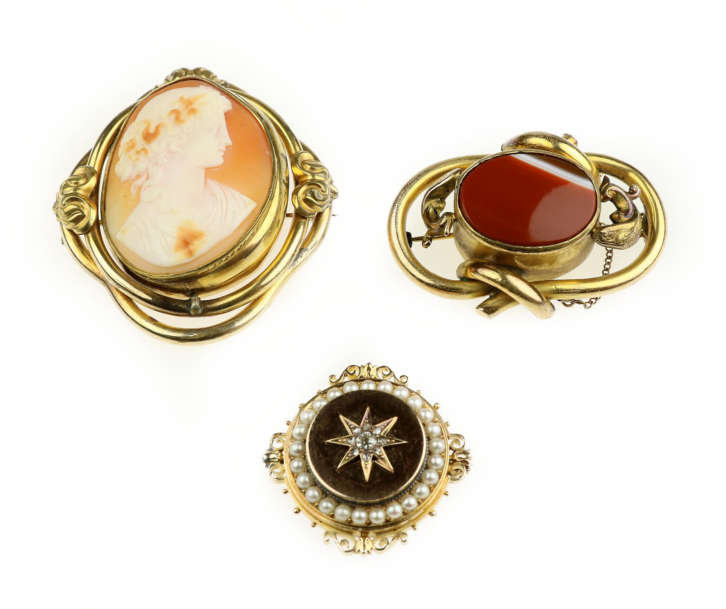 A shell cameo brooch and two gem-set brooches, Victorian