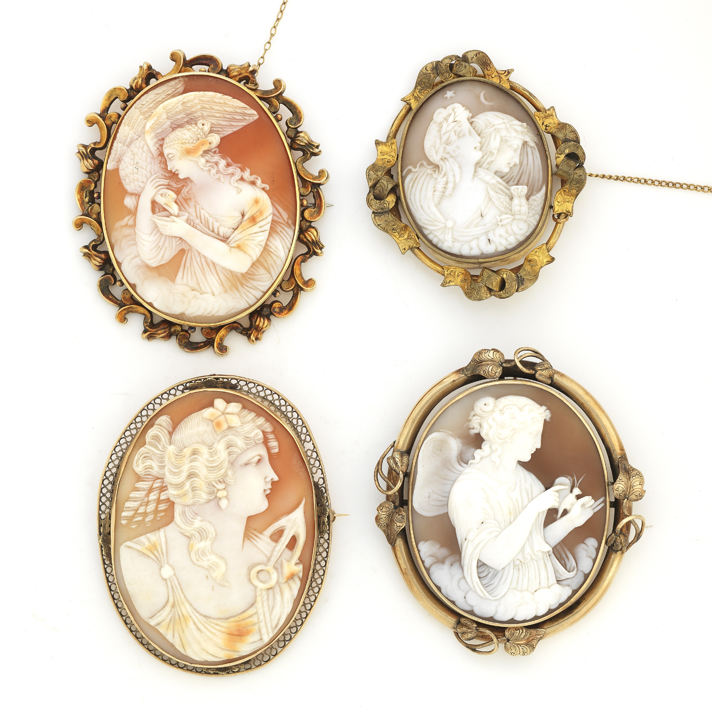 Four oval shell cameo brooches