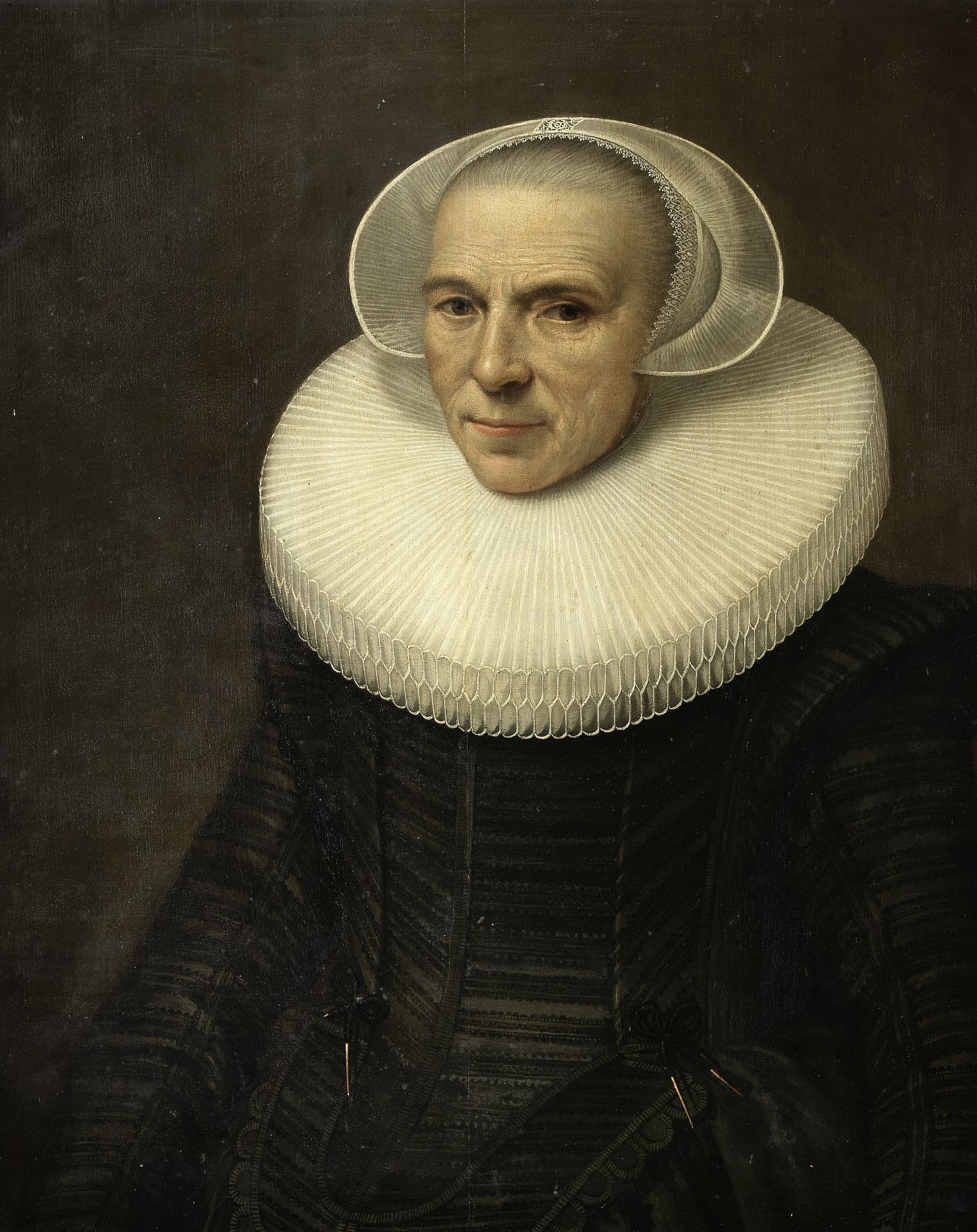 Dutch School, 17th Century Portrait of a lady, half-length, in black costume with a white ruff