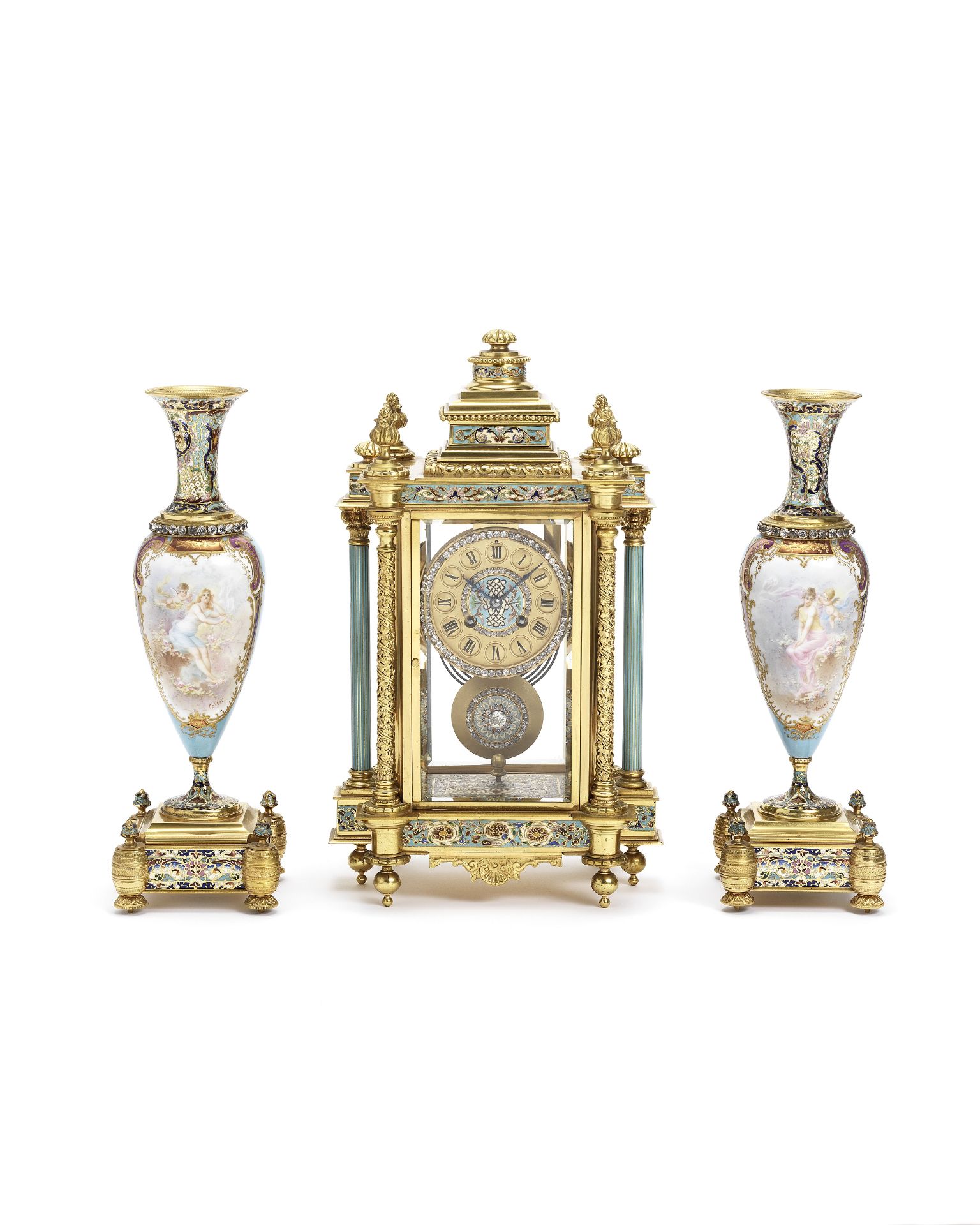 A fine late 19th century brass and cloisonné enamel mantel clock with a pair of associated vases ...