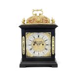 A late 17th century ebony brass-mounted basket-top table clock with pull quarter repeat Richard F...