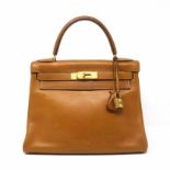 Gold Courchevel Kelly Retourne 28, Hermès, c. 1978, (Includes padlock, key, cloche, and dust bag)