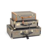 Three Goyardine Suitcases, Goyard, 1980s, (Includes two luggage tags and keys for the black trim...