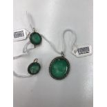 An emerald cameo and diamond pendant and pair of earrings,
