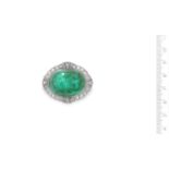 An emerald and diamond brooch,