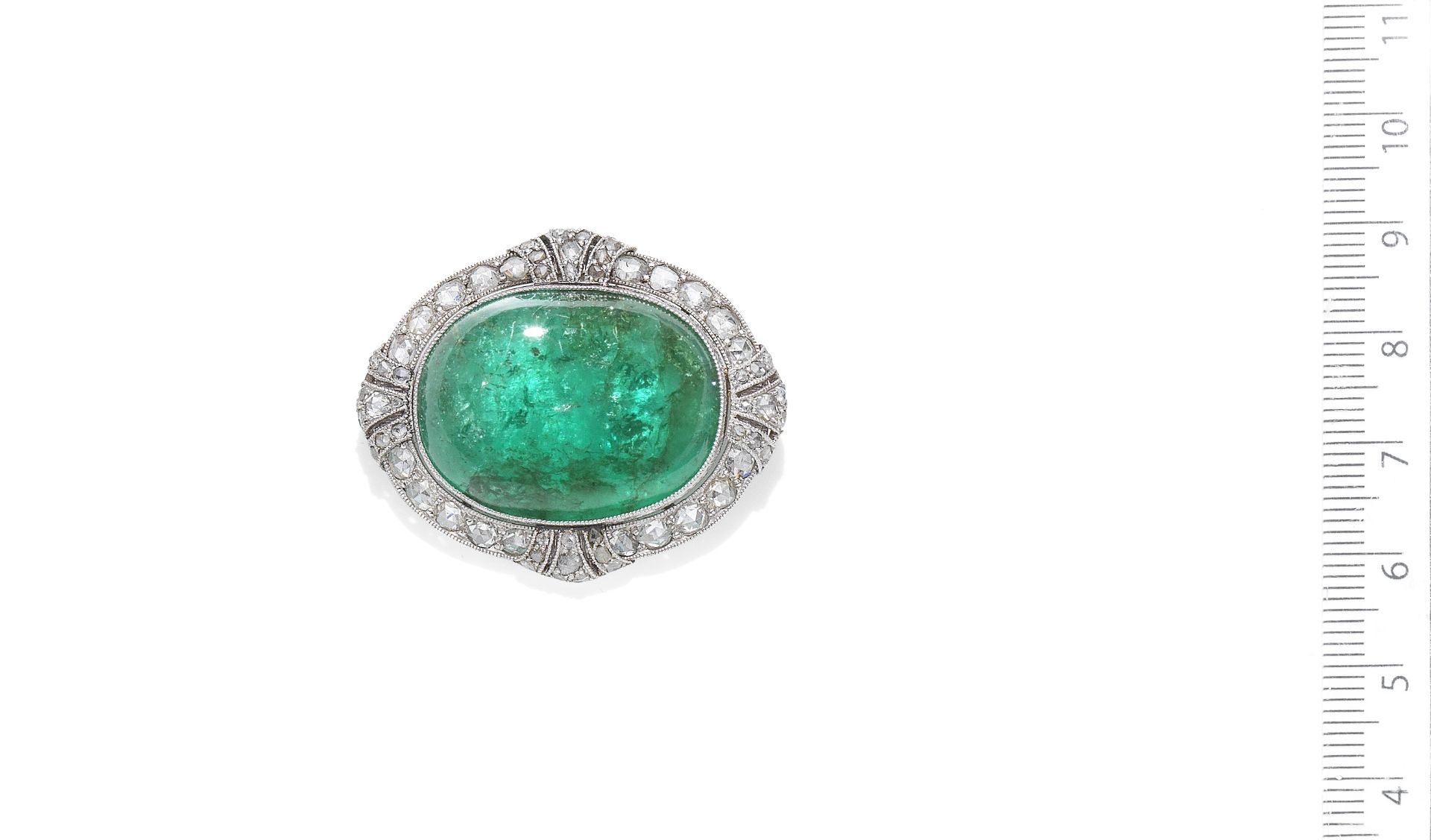 An emerald and diamond brooch,