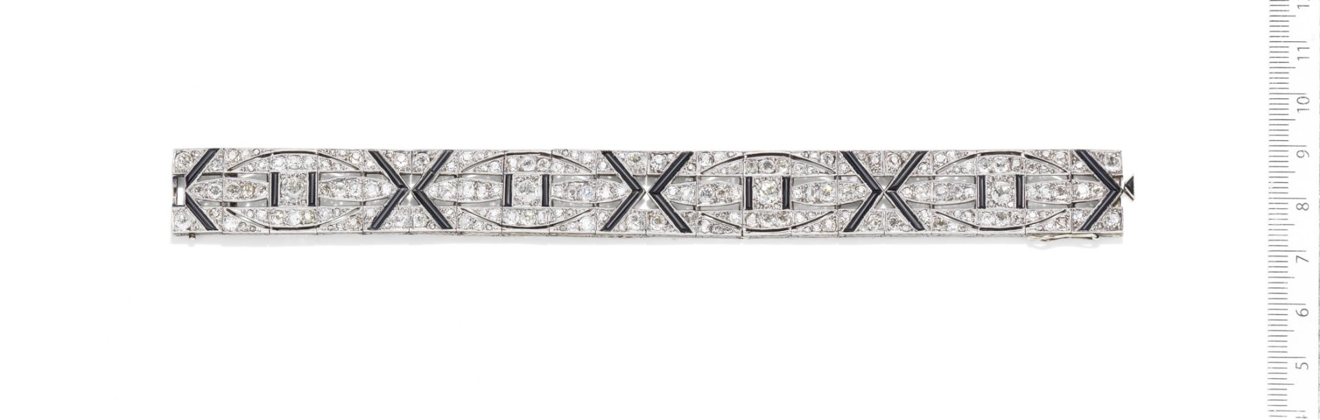 An Art Deco diamond and onyx bracelet,