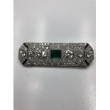 An Art Deco diamond and green paste brooch,