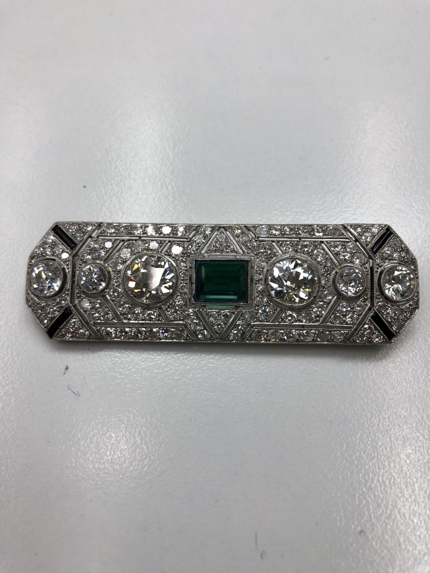 An Art Deco diamond and green paste brooch,