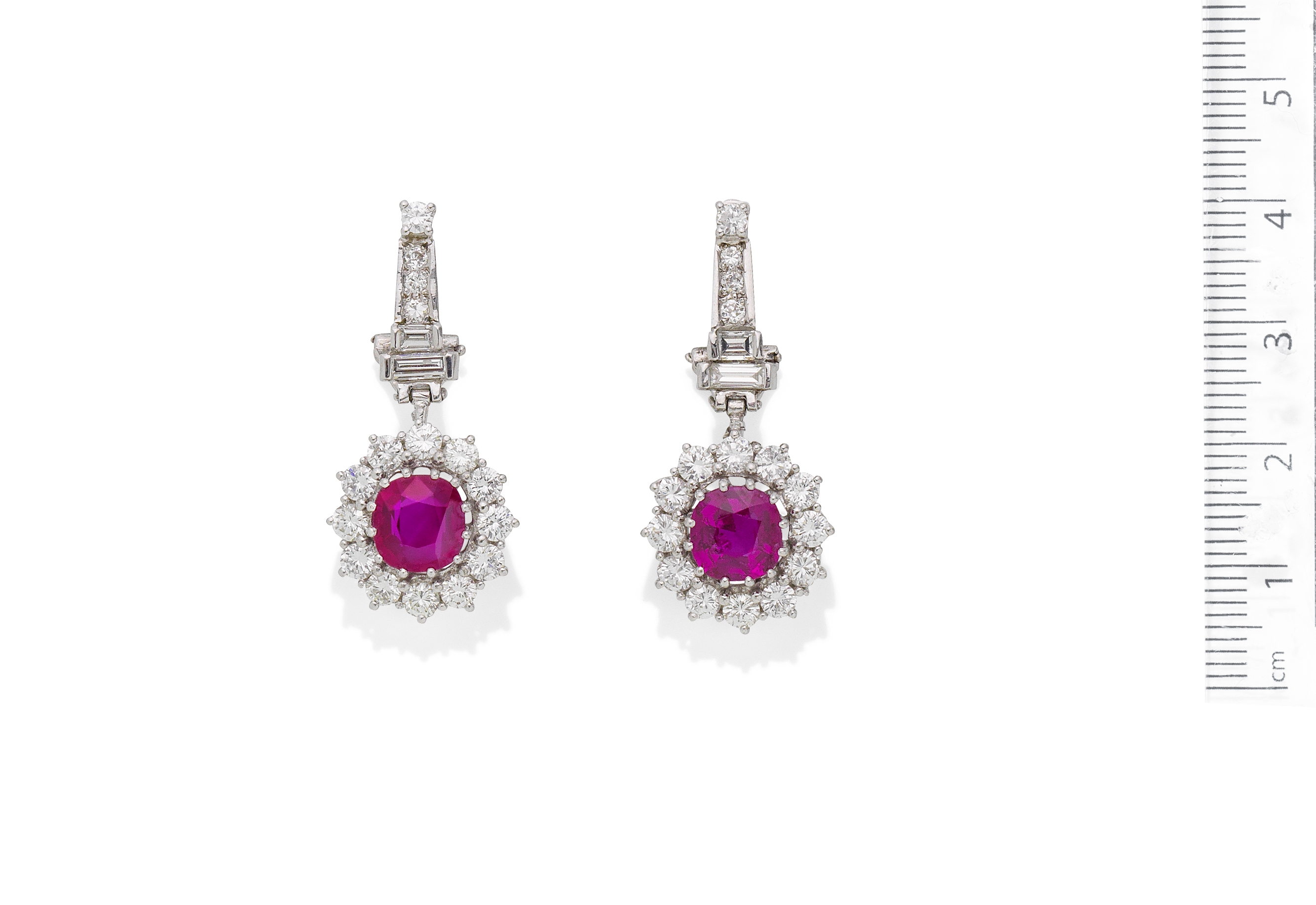 A pair of ruby and diamond pendent earrings