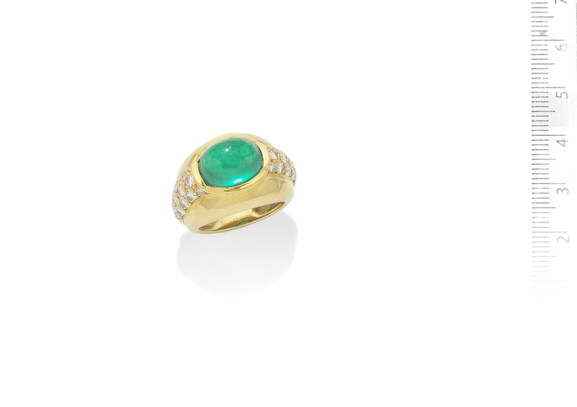 An emerald and diamond ring