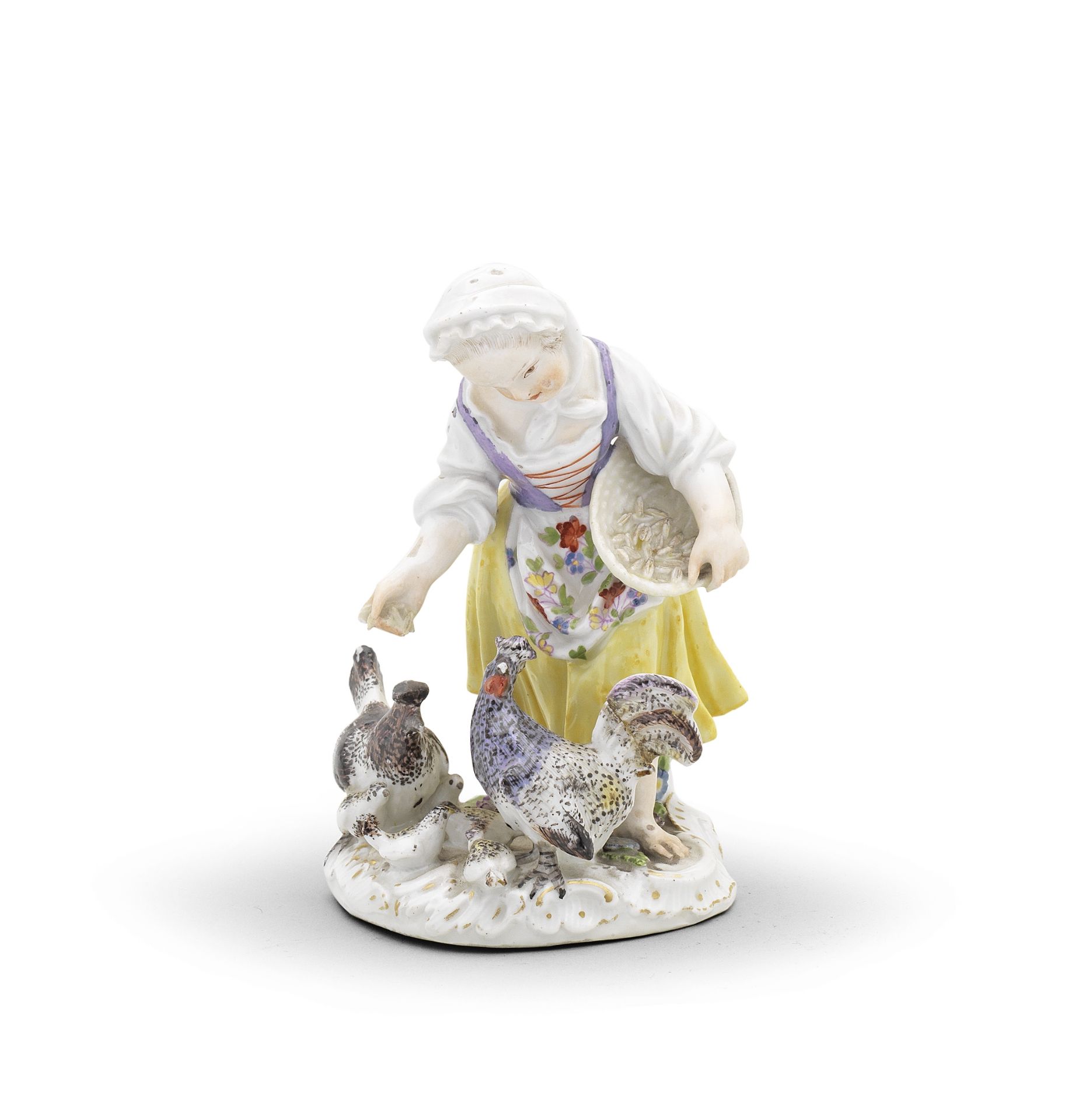 A Meissen figure of a girl feeding chickens, circa 1760