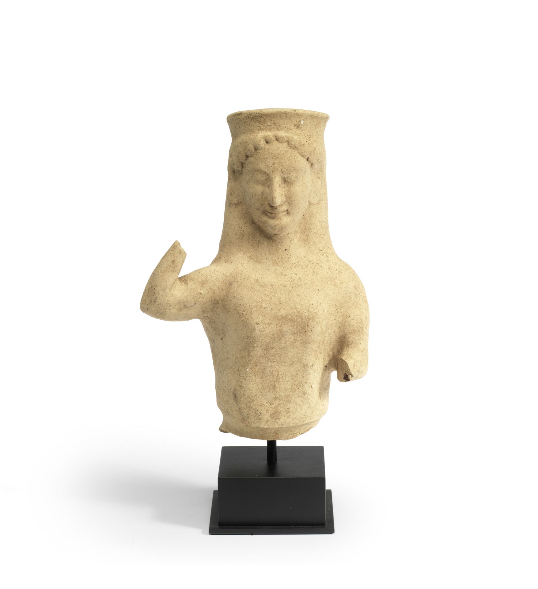 A Greek terracotta bust of a kore