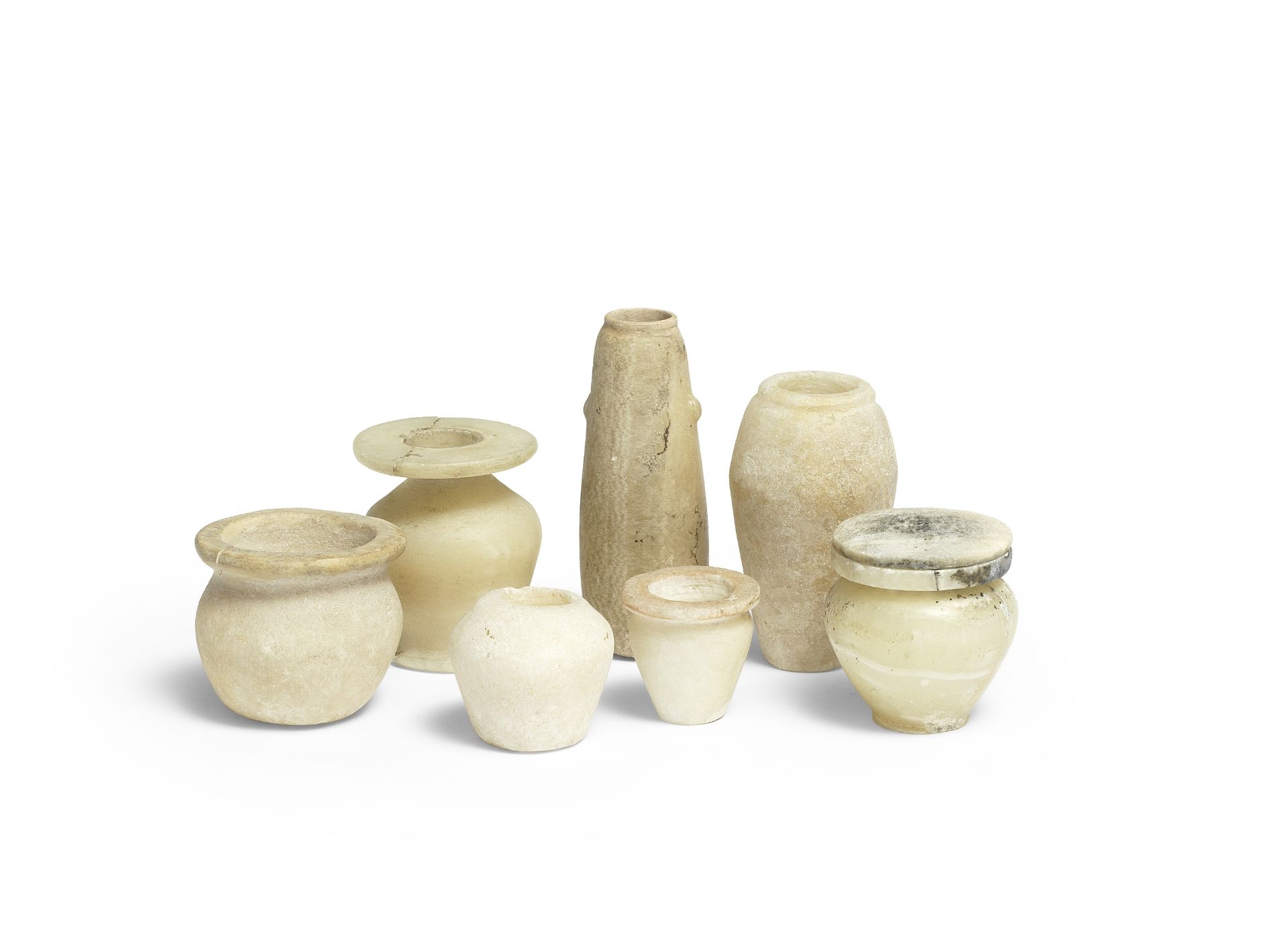 Seven Egyptian miniature alabaster vessels