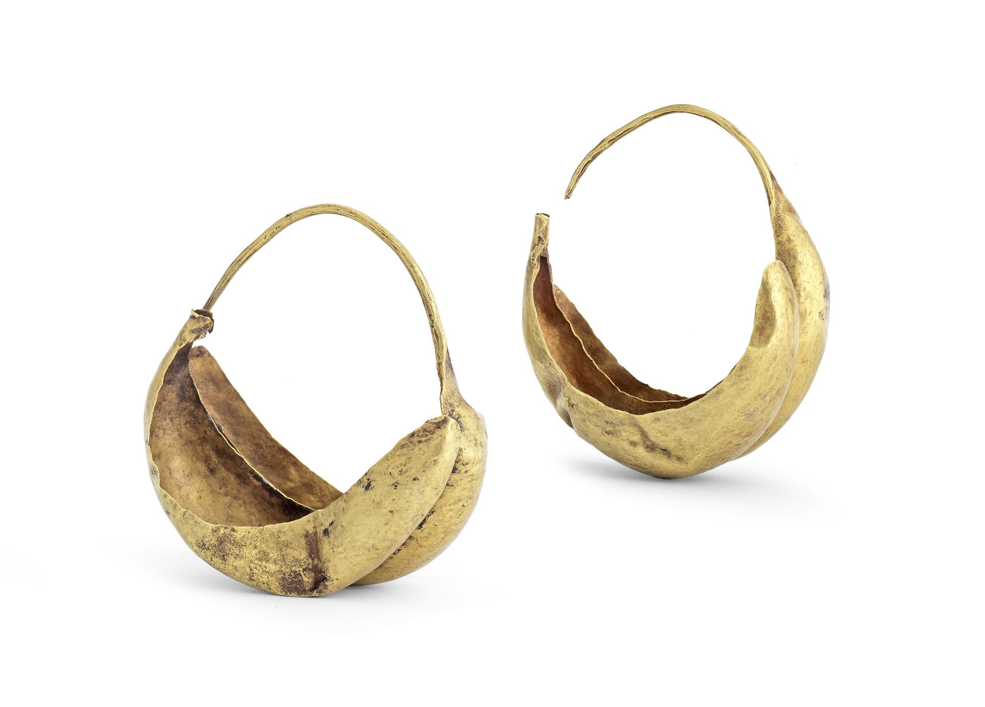 A pair of large Sumerian gold earrings 2