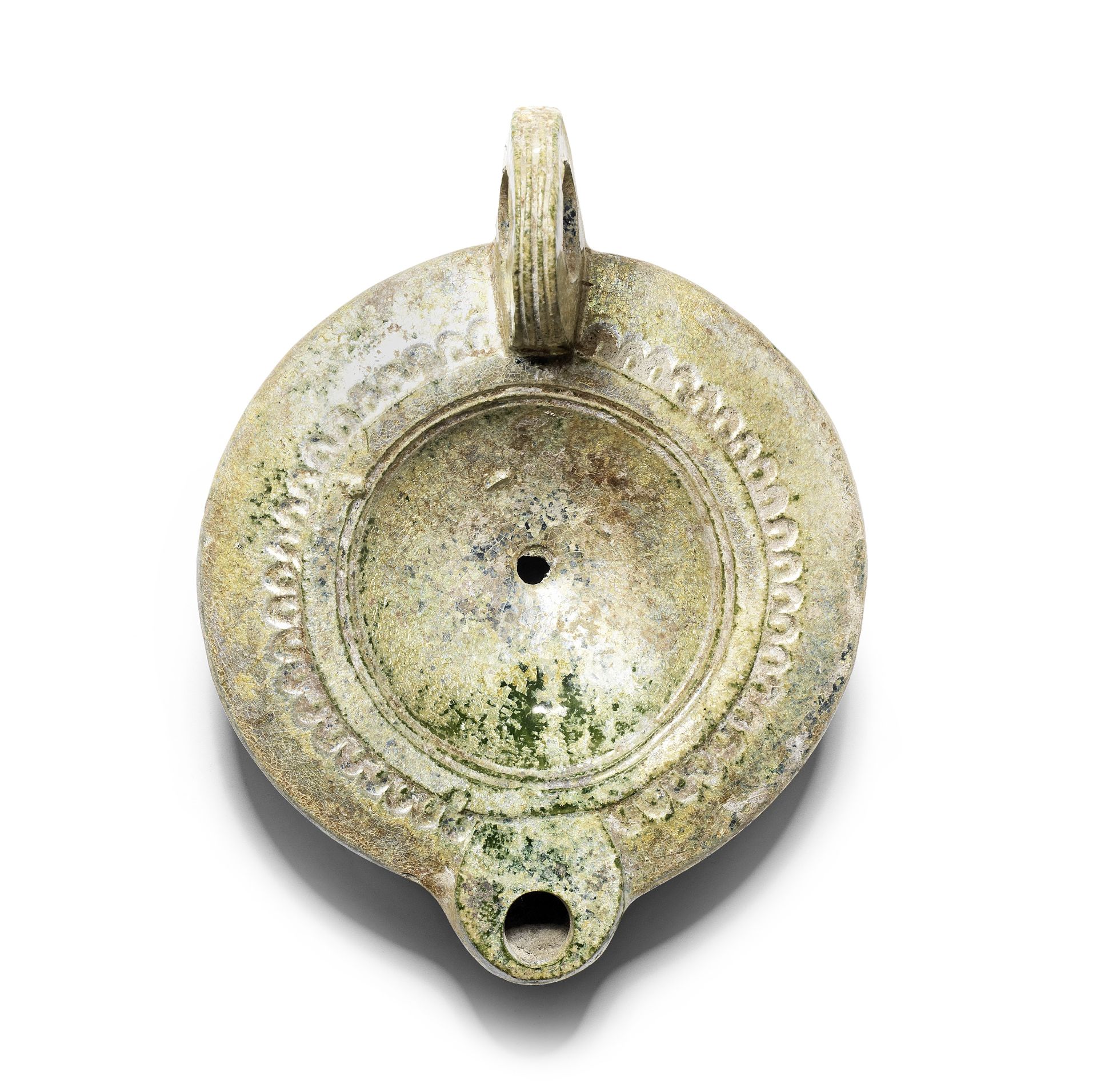 A large Roman lead-glazed pottery oil lamp