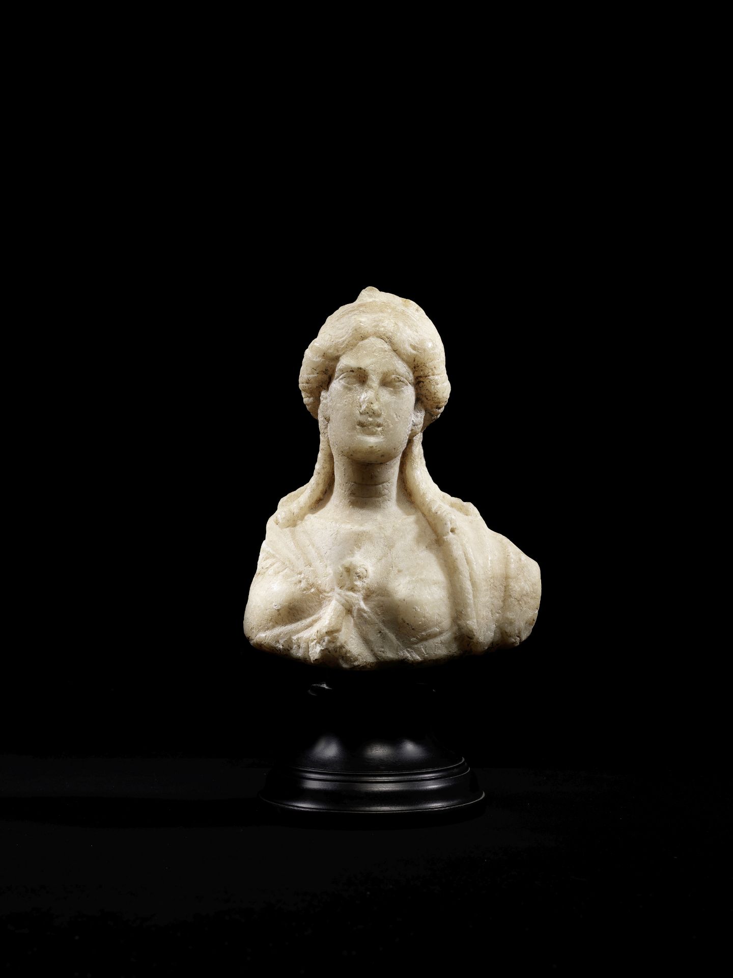 A Roman marble bust of Isis