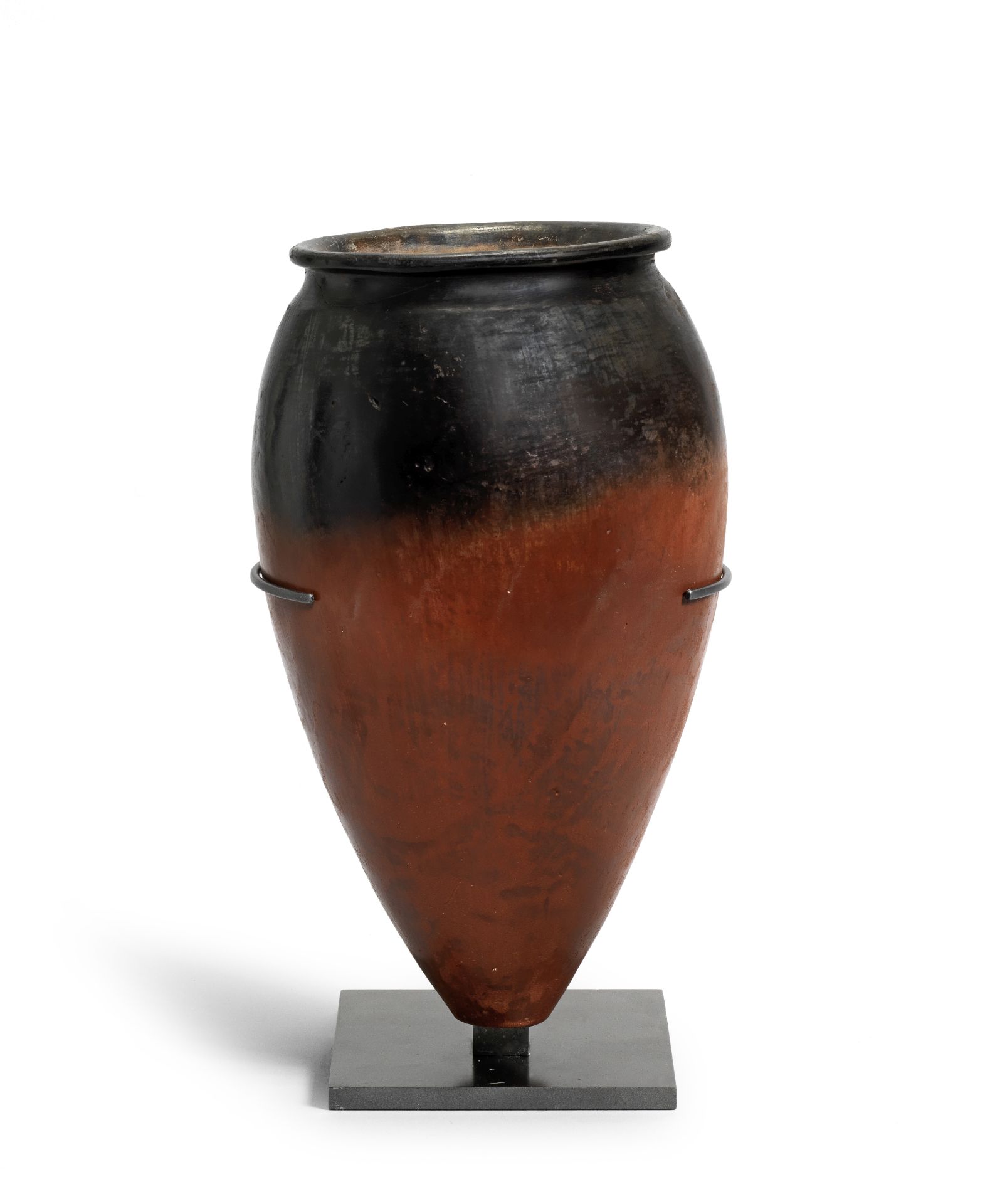 A large Egyptian black-topped pottery jar
