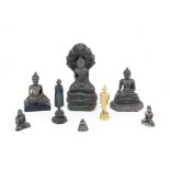 A group of eight various copper-alloy and yellow metal figures of Buddha Cambodia, Burma and Thai...