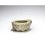 A chicken bone jade 'peach' washer 18th century