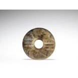 A large archaic-style jade disc, bi