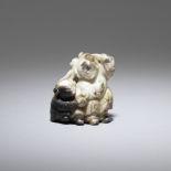 A chicken bone jade 'HeHe Erxian' group 17th/18th century